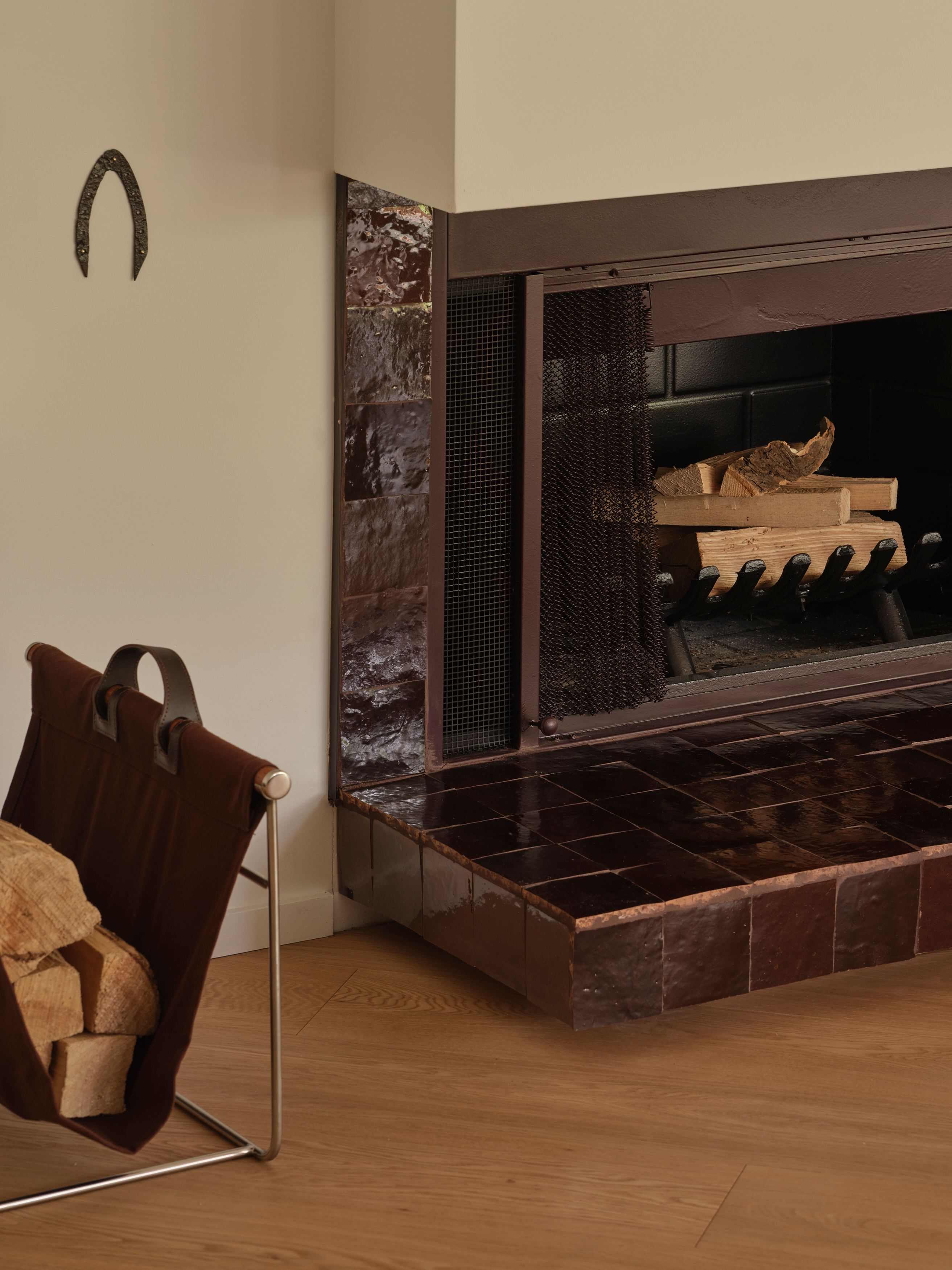 Wood-burning fireplace with glazed zellige tile surround in Suite 514