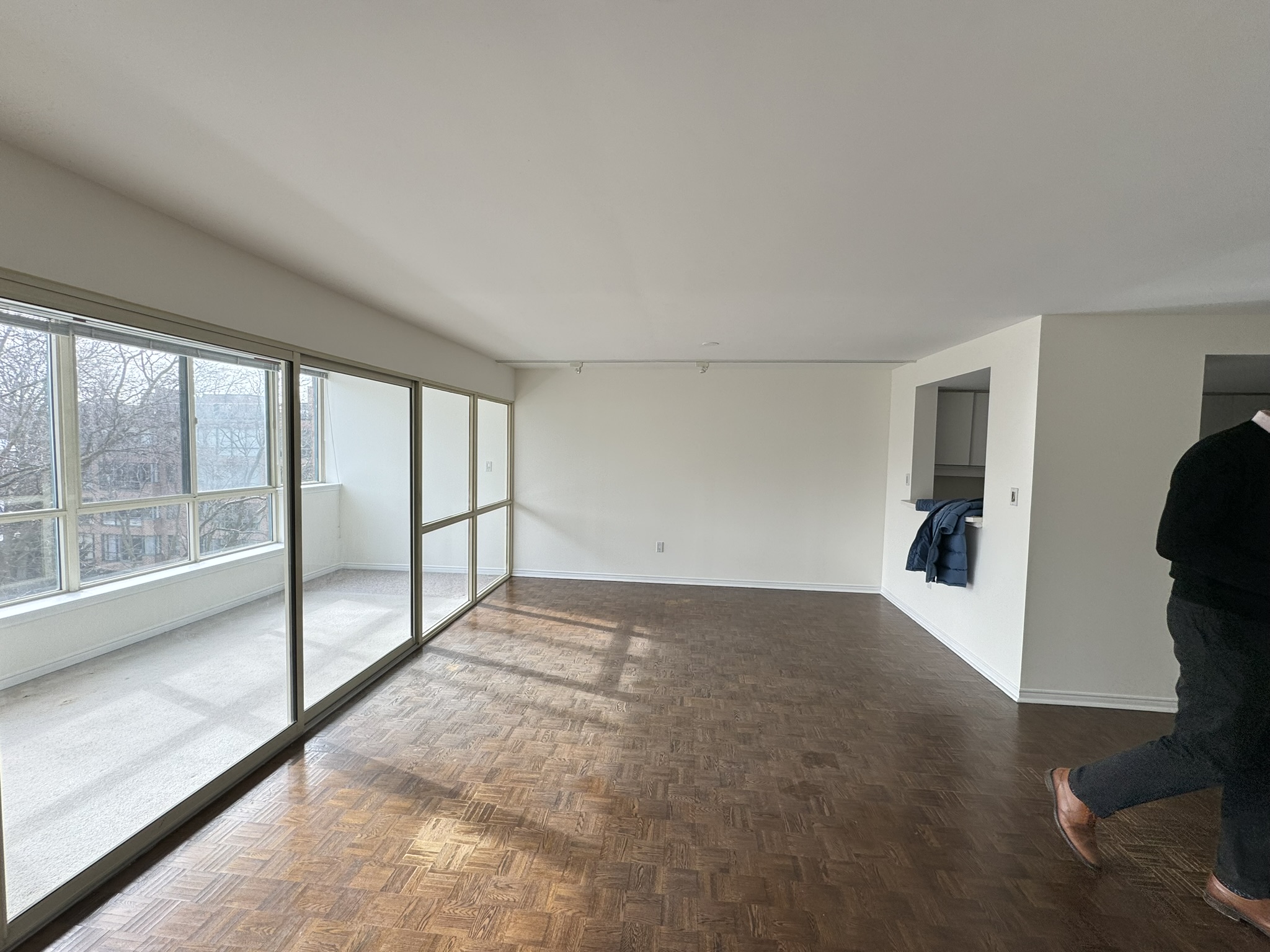 Original living space with glass-enclosed solarium before renovation